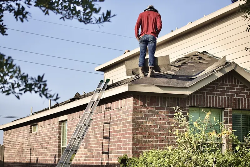 Professional roofer working on a residential roof in North San Antonio Hills